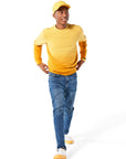 Man walking wearing yellow Ombre Crewneck with yellow Dipped Kicks shoes