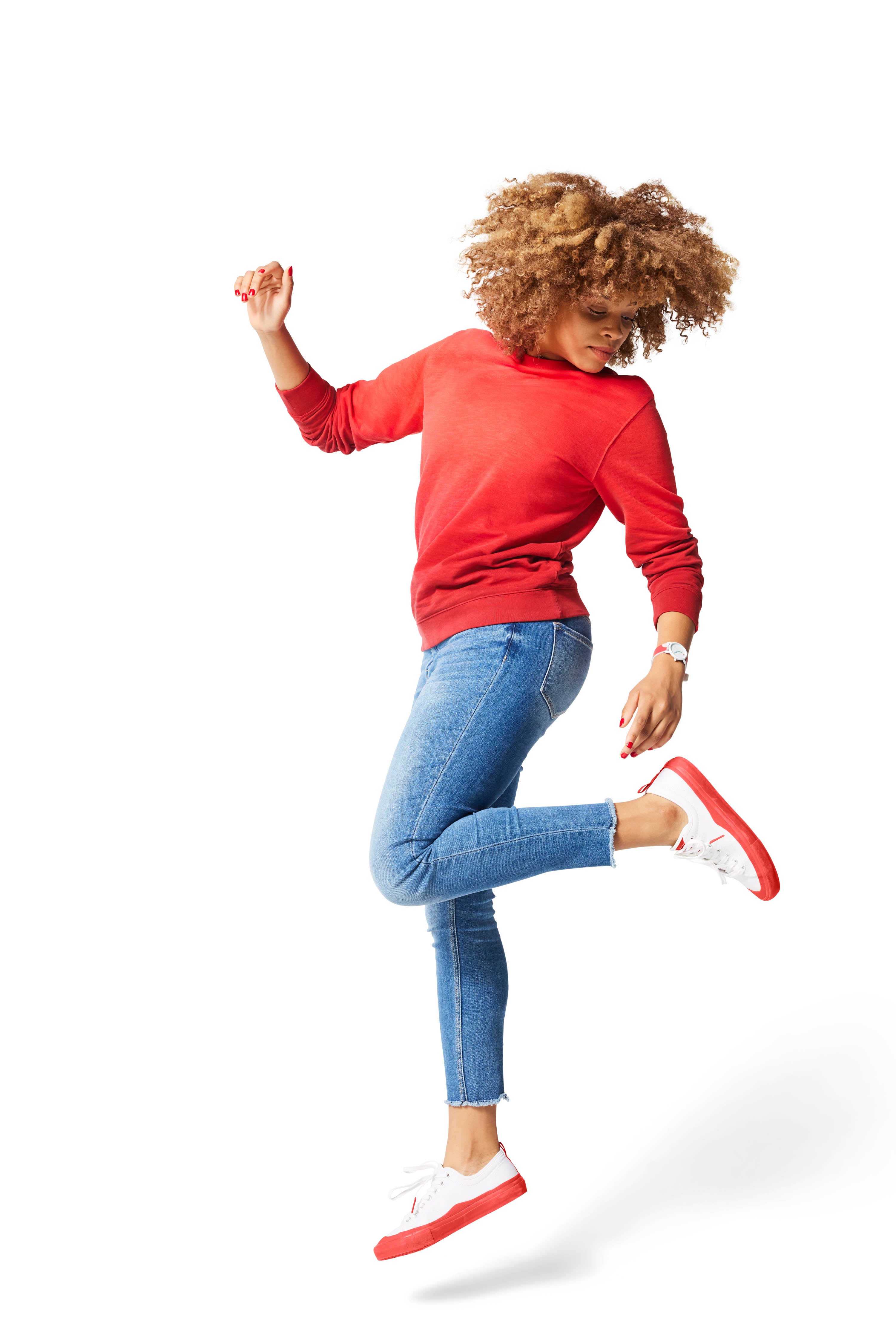 Woman jumping in air wearing red Ombre Crewneck with red Dipped Kicks shoes