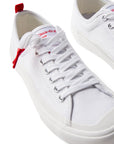 Pair of Dipped Kicks white shoes with white soles