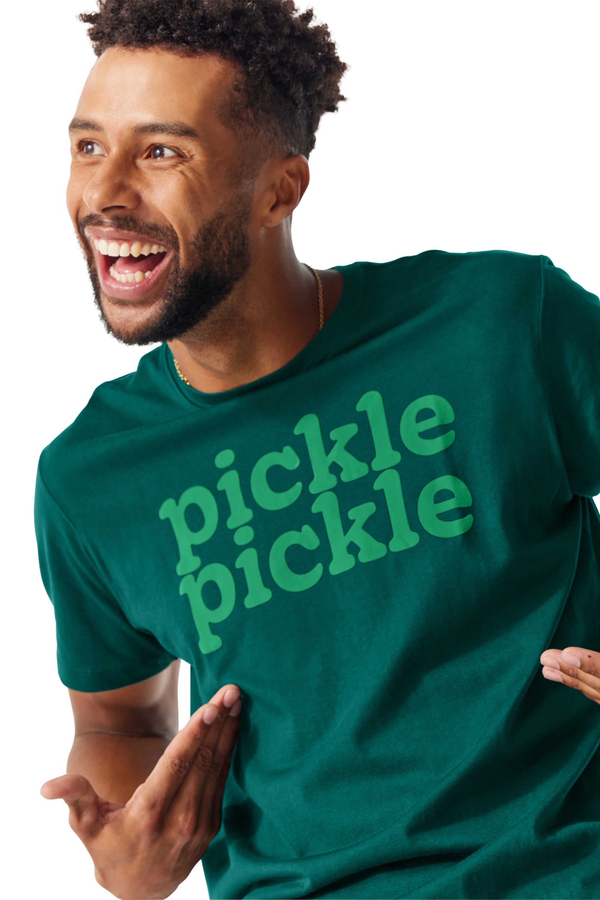 Man smiling and looking away from camera and showing off the Pickle Pickle Tee he is wearing