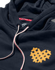 Closeup of heart-shaped Waffle Fry embroidery on I Heart Waffle Fries Hoodie