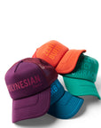 Stack of Sauce Trucker Hats including purple/Polynesian, orange/Zesty Buffalo, blue/Ranch, and green/Sriracha