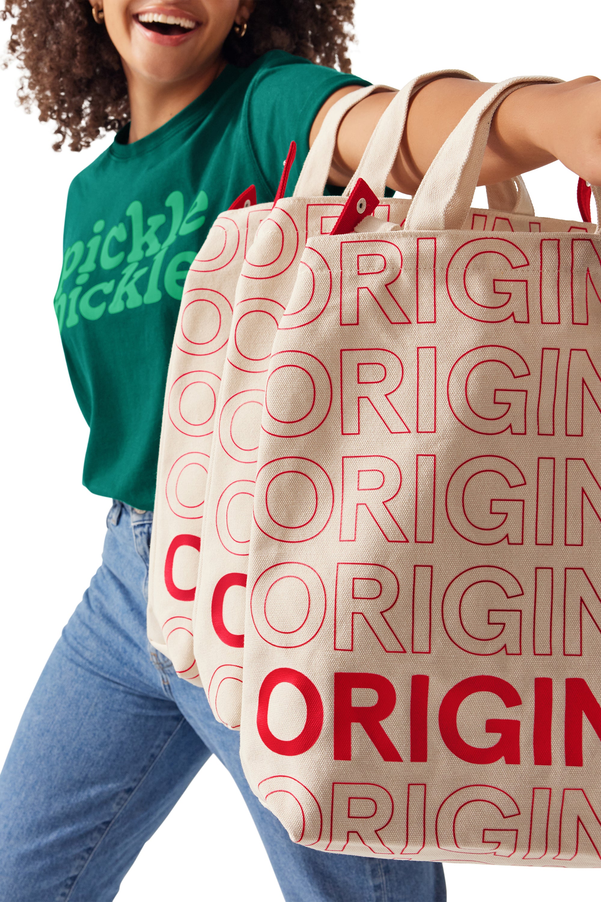 Woman holding three Chick-fil-A™ Original Bucket Totes on her extended arm