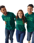 Two men and one woman each wearing Pickle Pickle Tee and walking together